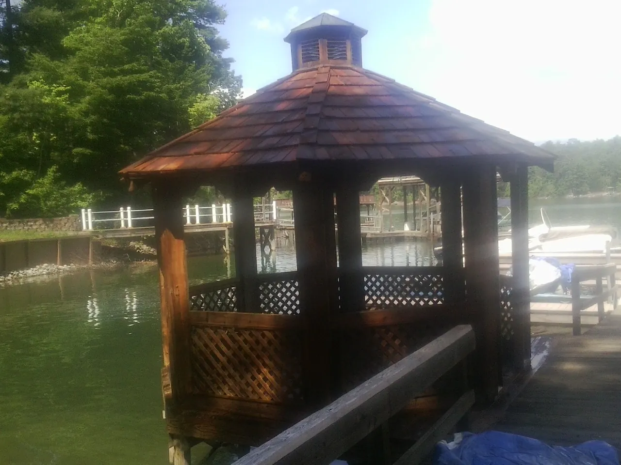 Cedar shake gazebo roof rebuilt on a lake dock in Deerfield Beach